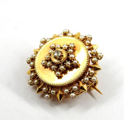 Circular brooch in yellow gold 750 thousandths...