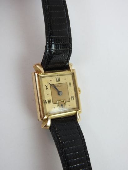 ROLEX: Man's watch, square case in yellow...