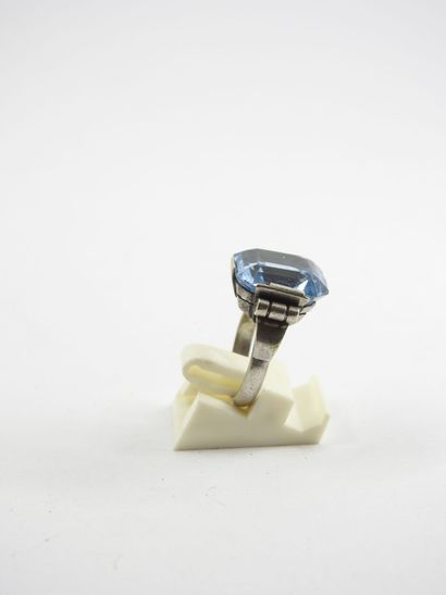 Silver ring decorated with a blue stone....