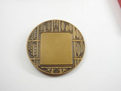 Two bronze CONTAUX sports medals. In a c...