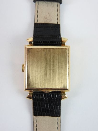 ROLEX: Man's watch, square case in yellow...