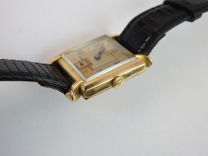ROLEX: Man's watch, square case in yellow...
