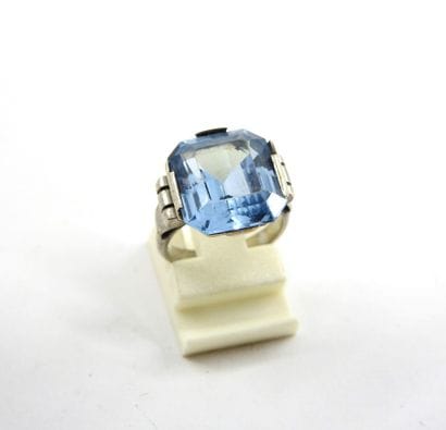 Silver ring decorated with a blue stone....
