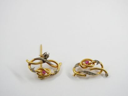 Yellow gold pin set with a small diamond...