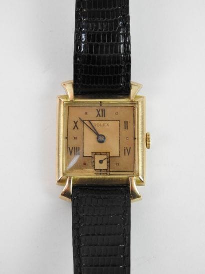 ROLEX: Man's watch, square case in yellow...