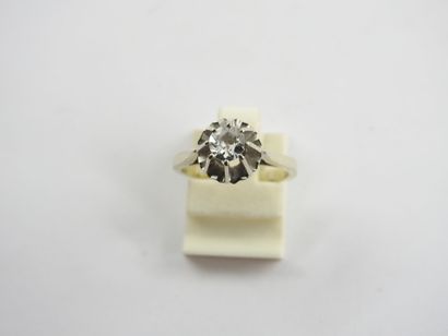 White gold solitaire ring set with a central...