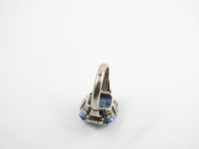 Silver ring decorated with a blue stone....