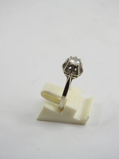 White gold solitaire ring set with a central...