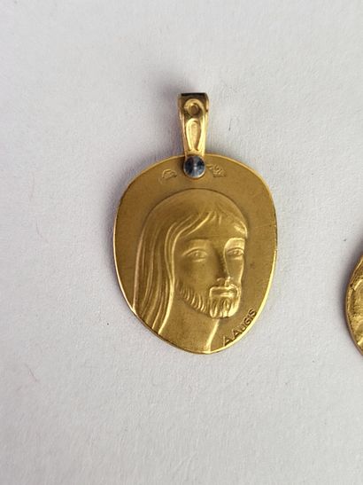 A. AUGIS.
Lot of 2 religious medals in yellow...
