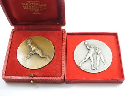Two bronze CONTAUX sports medals. In a c...