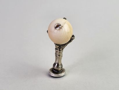 Silver seal showing an eagle's claw holding...