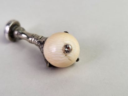 Silver seal showing an eagle's claw holding...