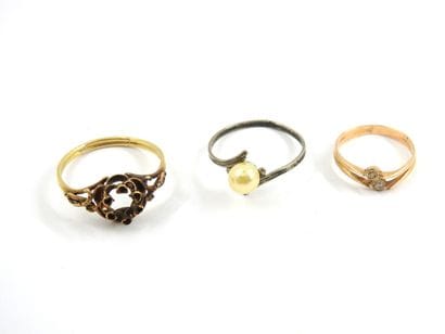 REUNION of two yellow gold rings and one...
