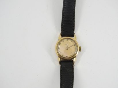 OMEGA: Women's watch with gold metal case...