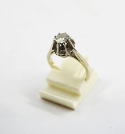White gold solitaire ring set with a central...