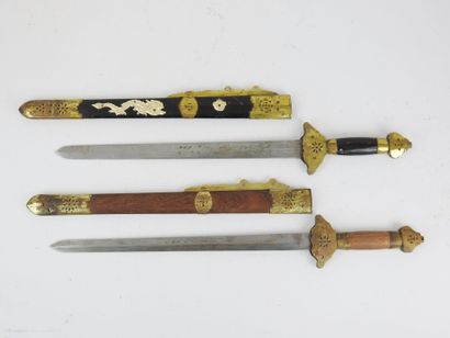 CHINA. Set of two daggers with brass mounts,...