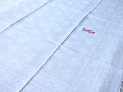 Twelve napkins decorated with flowers and...