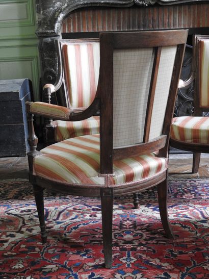 Suite of four armchairs in molded and carved...