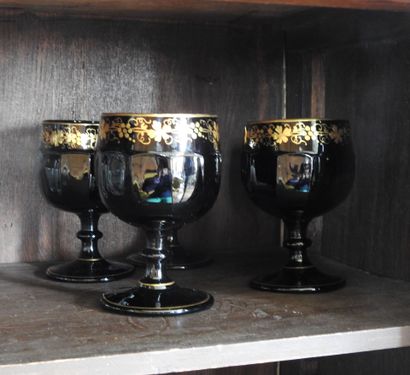 Suite of four large glasses in opaline with...