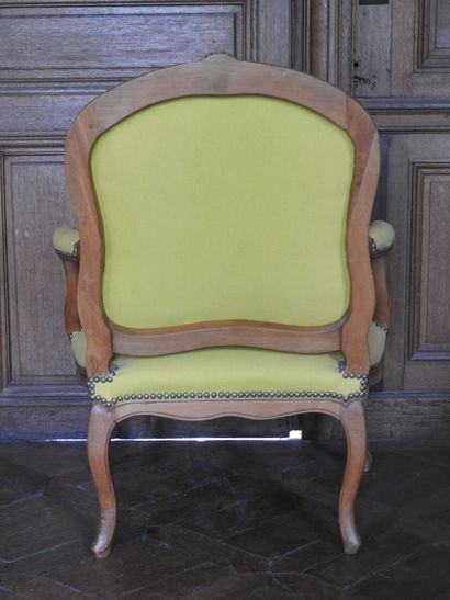 Pair of armchairs in natural wood molded...