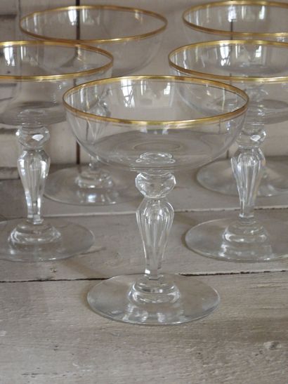 Suite of five crystal champagne glasses with...