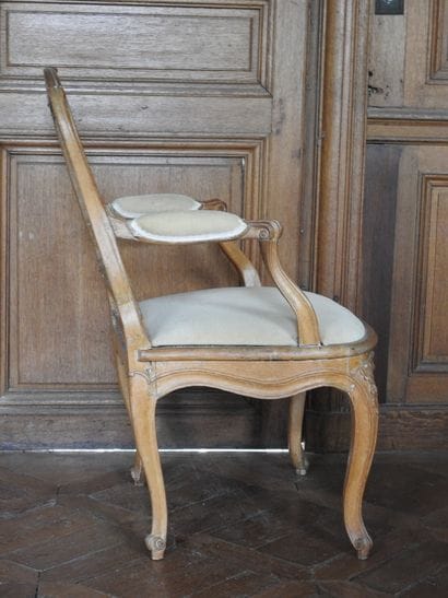 Armchair in molded and carved beech with...
