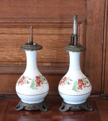 Pair of porcelain oil lamps with polychrome...