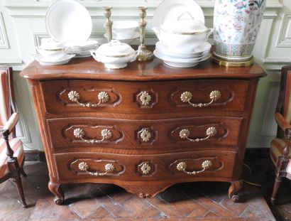 Walnut chest of drawers, molded and carved,...