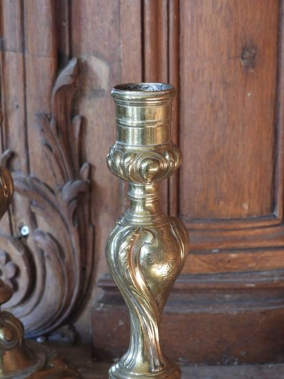Pair of bronze torches with rocaille decoration....