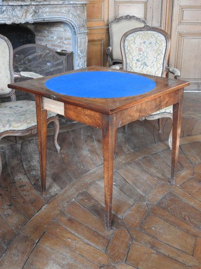 Mahogany and mahogany veneer game table resting...