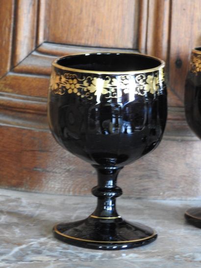 Suite of four large glasses in opaline with...