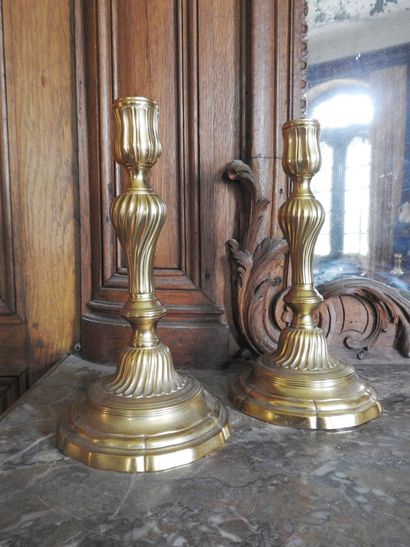 Pair of ormolu torches with torso shaft....