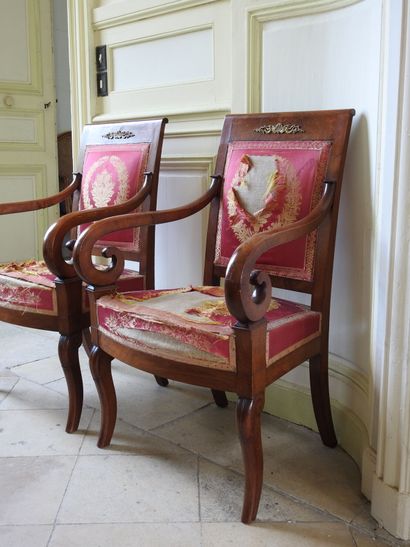 Suite of four mahogany armchairs, the armrests...