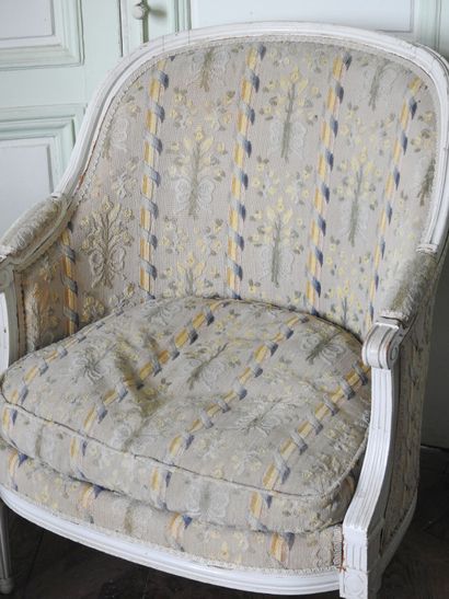 Louis XVI style molded and carved wood armchair...