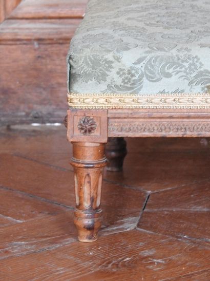 Pair of carved molded wood footrests resting...