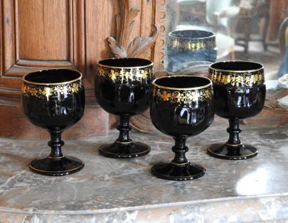 Suite of four large glasses in opaline with...