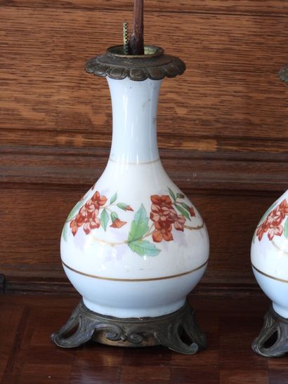 Pair of porcelain oil lamps with polychrome...