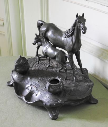 Inkwell in regula with brown patina representing...