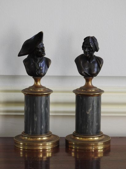 Pair of bronze busts with brown patina representing...