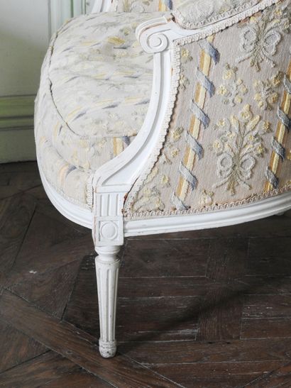 Louis XVI style molded and carved wood armchair...