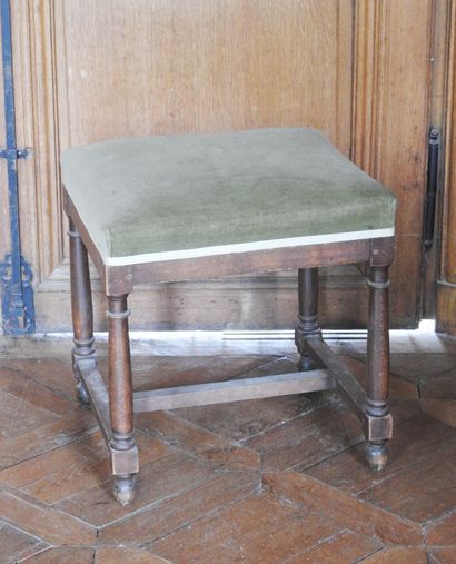 Walnut stool with four baluster feet joined...
