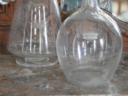 Meeting of two crystal decanters with engraved...
