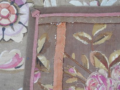 Large Aubusson carpet, the brown field decorated...