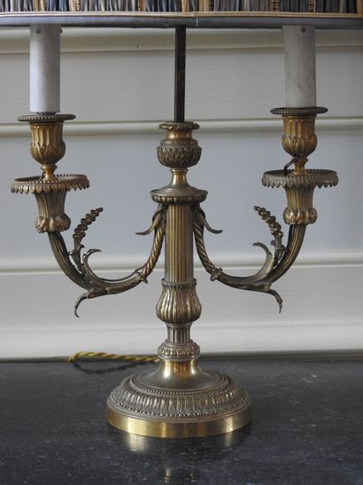 Pair of Louis XVI style candlesticks in chased...