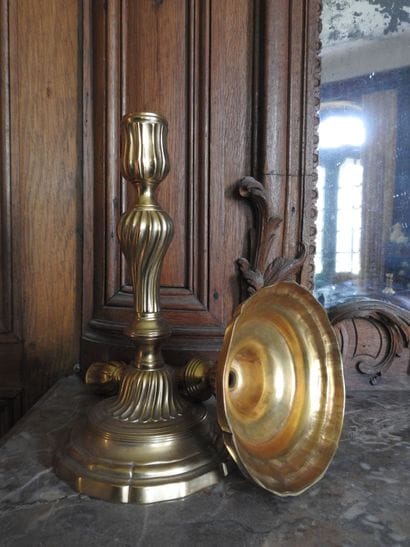 Pair of ormolu torches with torso shaft....