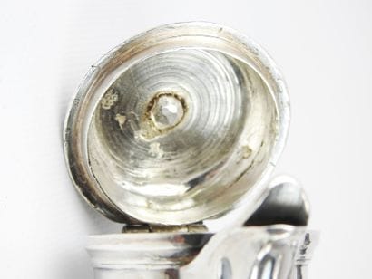 Silver tripod selfish jug decorated with...