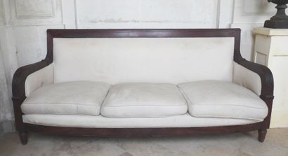 Large mahogany sofa, the ribbed armrests...