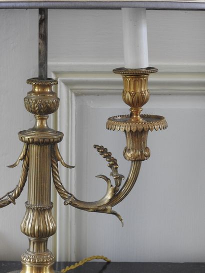 Pair of Louis XVI style candlesticks in chased...