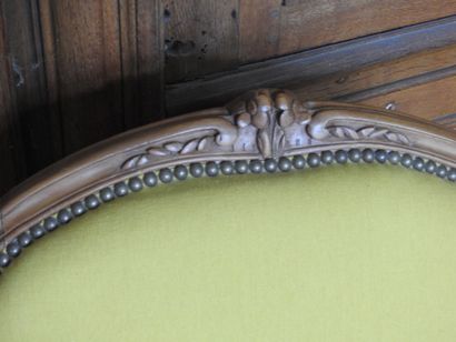 Pair of armchairs in natural wood molded...