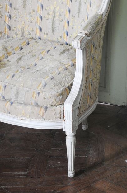 Louis XVI style molded and carved wood armchair...